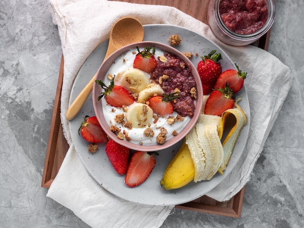 a healthy fruit snack with bananas and strawberries